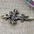 1030TQ - TURQUOISE STONE CROSS CANDLE PIN W / FDL