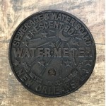 1233 - IRON WATERMETER TRIVET